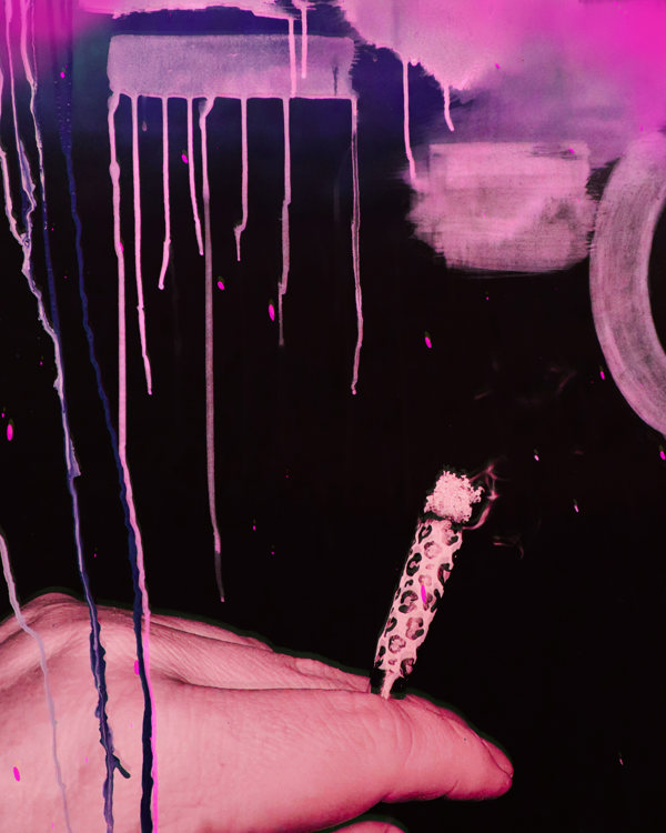 Photograph of a woman’s hand holding a leopard print joint with smoke rising in the air. Hand painted embellishment and drips in purple, pink and fuchsia at the top.